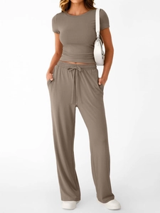 Detailed texture of coffee ribbed short sleeve T-shirt and drawstring wide leg trousers