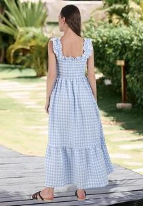 Detailed back view of a light blue gingham summer dress with a smocked bodice and tiered hem