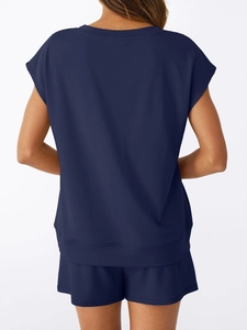 Back view of a navy blue two-piece lounge set showing loose fit cut and soft fabric texture