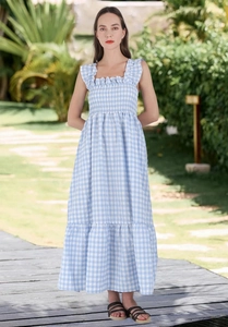 Detail of smocked square neck bodice on light blue plaid maxi dress for summer