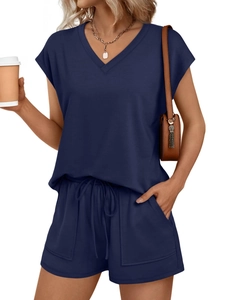 Detail of dark blue V-neck short sleeve top and matching drawstring shorts with pockets