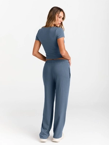 Detail view of the blue casual two-piece set featuring back fit and wide-leg trousers