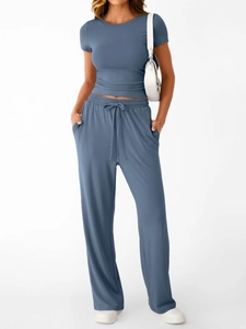Detail view of the soft knitted fabric and drawstring waist on blue casual 2-piece set