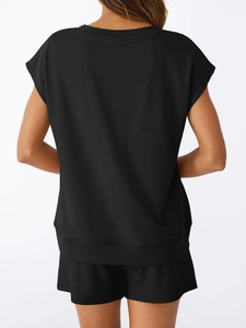 Detail view showing back of black V-neck short sleeve top and matching drawstring shorts