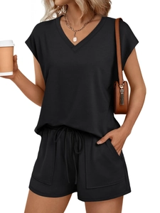 Detail of a women's black V-neck short sleeve top and drawstring shorts with side pockets