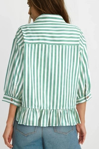 Rear view of green and white striped shirt featuring ruffle hem and wide sleeves