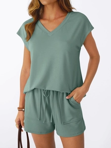 Detail of sage green lounge set with V-neck short sleeve top and drawstring shorts