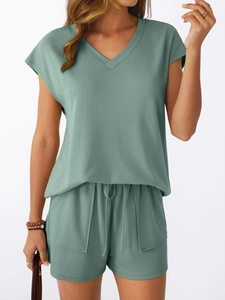 Detail of sage green V-neck short sleeve top and drawstring shorts summer lounge set