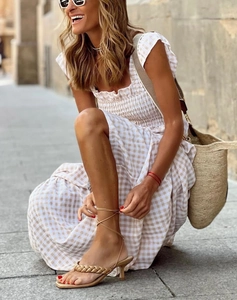 Detailed view of the square neckline and smocked plaid maxi dress for women