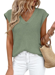 Macro detail of grass green V-neck knit top showing thick stitch waffle texture and soft fabric
