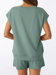 Rear view of comfortable sage green knit V-neck short sleeve top and shorts lounge set