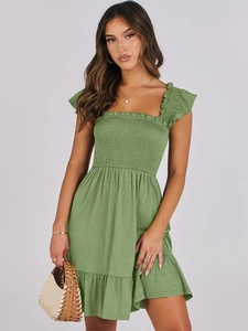 Detail of green smocked dress with square neck and ruffled sleeves for summer