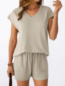 Close-up of the soft knitted texture and drawstring detail on the V-neck lounge set