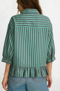 Detail view of a green and gray striped shirt with bell sleeves and ruffled hem