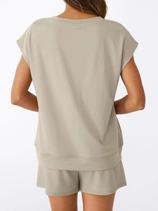 Rear view detail of soft beige V-neck short sleeve top and casual matching shorts set