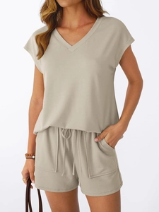 Detail of V-neck short sleeve top and drawstring shorts in khaki knit fabric