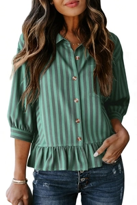 Detail of green striped shirt featuring wood buttons, chest pocket, and ruffle hemline