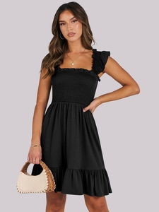 Detail of square neck smocked black dress with ruffled straps and A-line silhouette