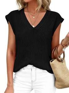 Detail of black V-neck sleeveless knit vest featuring a thick textured stitch pattern