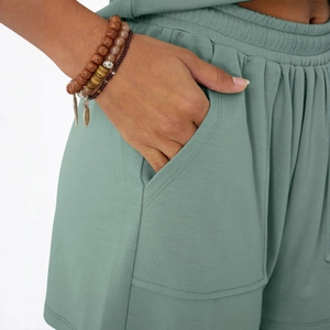 Women's sage green knit shorts set with elastic waist and side pockets for casual wear