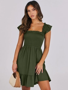 Detail of smocked olive green plaid dress with ruffled neckline and elastic bodice