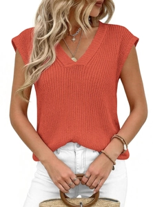 Close-up detail of terracotta V-neck chunky knit vest showing textured vertical patterns