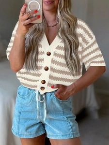 Detail of V-neck striped knit cardigan with tortoise buttons and retro wavy pattern