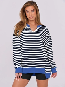 Detail of the V-neckline with blue ribbed trim and striped pattern on the casual sweatshirt
