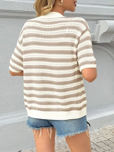 Detail shot of hollow knit texture and brown striped pattern on a V-neck summer cardigan
