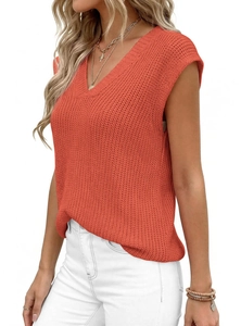 Detail of V-neck brick red knit tank top showing coarse needle texture and relaxed fit