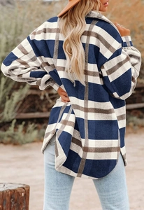 Detail of blue and white plaid flannel shirt jacket with drop shoulders and curved hem
