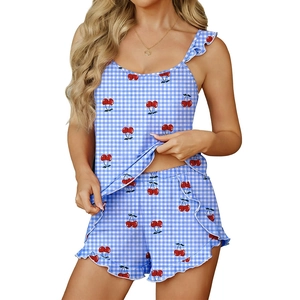 Women's summer pajama set with blue gingham print, cherry motifs and ruffle strap details