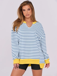 Close-up of color block striped sweatshirt with V-neckline and yellow ribbed trim details