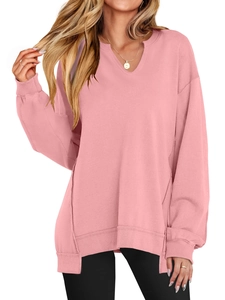 Front view of women's loose V-neck pink sweatshirt with dropped shoulder and ribbed cuffs