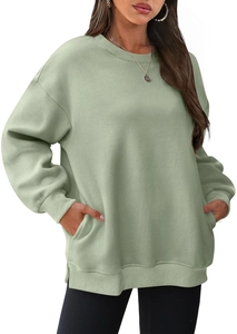Sage green oversized crewneck sweatshirt featuring side pockets and ribbed cuffs detail