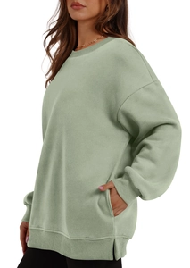 Detailed side view of sage green fleece sweatshirt with drop shoulder and ribbed cuffs