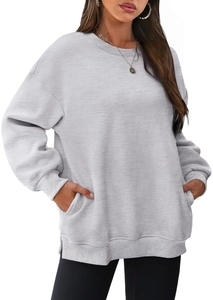 Detail of light grey crewneck sweatshirt featuring ribbed cuffs and side hand pockets