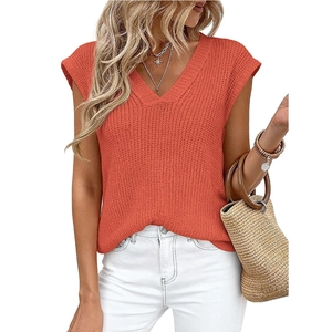 Women's V-neck orange knit sleeveless sweater vest with a ribbed texture and relaxed fit