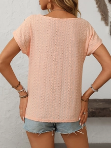 Detailed back view of short sleeve top with geometric hollow-out jacquard texture