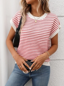 Detail of red and white striped knit top showing ribbed neckline and woven texture