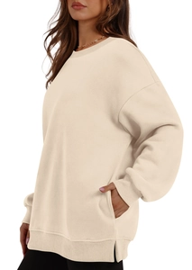 Detailed side view of cream beige oversized hoodie featuring drop shoulders and side pockets