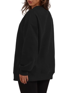 Side view of a black oversized crewneck sweatshirt with ribbed cuffs and drop shoulders