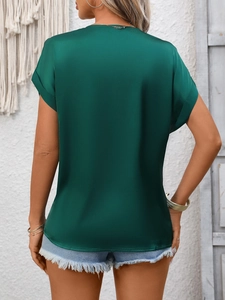 Detailed back view of dark green satin short sleeve top with elegant silk texture