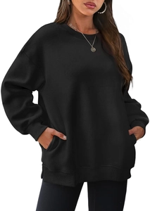 Macro shot of oversized black fleece sweatshirt showing side pockets and ribbed texture