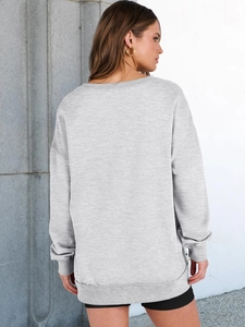 Detailed back view of a grey loose-fit sweatshirt with drop shoulder and textured fabric