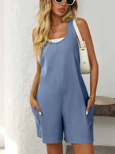 Detail view of a dusty blue sleeveless romper with functional side pockets and vertical seams