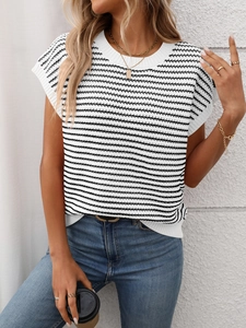 Detail shot of black and white striped knit top with round neck and ribbed texture