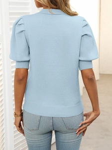 Back view of light blue puff sleeve knit top featuring ribbed cuffs and a slim fit cut
