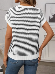 Detail of knitted women's top showing horizontal black stripes and ribbed hem on back