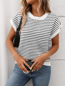 Detailed knit texture of a black and white striped short sleeve sweater with ribbed edges